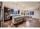 Modern kitchen featuring a large center island, seating, and stainless steel appliances at 6652 W Asbury Pl, Lakewood, CO 80227