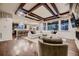 Spacious open concept living room featuring a modern coffered ceiling and hardwood floors at 6652 W Asbury Pl, Lakewood, CO 80227