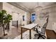 Office space featuring a modern chandelier, wainscoting, and bright natural light at 6652 W Asbury Pl, Lakewood, CO 80227