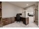 Home office with a large desk, comfortable chair, built-in shelves, and plenty of space for productivity at 6652 W Asbury Pl, Lakewood, CO 80227