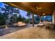 Covered outdoor patio with a fire pit, ample seating, and ceiling fans at 6652 W Asbury Pl, Lakewood, CO 80227