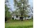 View of the grassy backyard and fencing surrounding the property at 4549 S Acoma S St, Englewood, CO 80110