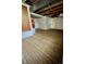 Partially finished basement with carpet, exposed ceiling, and block walls ready for customization at 4549 S Acoma S St, Englewood, CO 80110