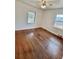 Bedroom featuring hardwood floors, ample natural light, and spacious layout at 4549 S Acoma S St, Englewood, CO 80110