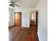 Bedroom with hardwood floors and a glimpse into the hallway at 4549 S Acoma S St, Englewood, CO 80110