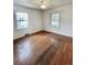 Bright bedroom with hardwood floors and dual windows offering plenty of light at 4549 S Acoma S St, Englewood, CO 80110