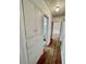 Hallway with wood floors and built-in cabinets offers practical storage at 4549 S Acoma S St, Englewood, CO 80110