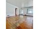 Open living room with hardwood floors, ample space and natural light at 4549 S Acoma S St, Englewood, CO 80110