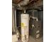 Close-up of the water heater and furnace unit with ductwork and plumbing in the home's basement at 4549 S Acoma S St, Englewood, CO 80110