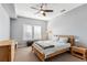 Comfortable bedroom with light wood bed frame and ceiling fan at 22390 E Hidden Trail Dr, Parker, CO 80138