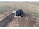 Aerial view of a newly constructed home with a large three car garage and ample land at 49601 E 56Th Ave, Bennett, CO 80102