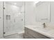 Bathroom features marble tile shower, modern vanity, and new fixtures at 49601 E 56Th Ave, Bennett, CO 80102