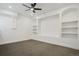 Spacious bonus room featuring built-in shelving, neutral carpet, and recessed lighting at 49601 E 56Th Ave, Bennett, CO 80102