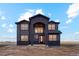 Beautiful two-story home with black siding and a modern architectural design on a spacious lot at 49601 E 56Th Ave, Bennett, CO 80102