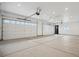 Spacious three car garage with clean lines and a well-lit interior, perfect for storage and vehicles at 49601 E 56Th Ave, Bennett, CO 80102
