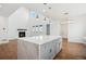 Modern kitchen featuring a large island, pendant lighting, and a bright, open design with views at 49601 E 56Th Ave, Bennett, CO 80102