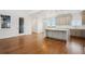 Bright kitchen with grey cabinetry, stainless steel appliances, large island and open floor plan at 49601 E 56Th Ave, Bennett, CO 80102