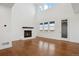 Inviting living room with a fireplace, high ceilings and views of the outdoors at 49601 E 56Th Ave, Bennett, CO 80102