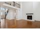 Bright living room boasts soaring ceilings, a fireplace, and hardwood floors at 49601 E 56Th Ave, Bennett, CO 80102