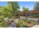 Charming backyard garden with raised beds, gravel pathways, and lush landscaping at 815 S Gaylord St, Denver, CO 80209