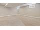 Finished basement with neutral carpet, recessed lighting, and windows at 815 S Gaylord St, Denver, CO 80209