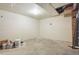 Unfinished basement space with concrete flooring and white drywall at 815 S Gaylord St, Denver, CO 80209