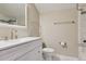 The bathroom showcases a modern vanity, faucet, a large mirror, and updated fixtures at 815 S Gaylord St, Denver, CO 80209