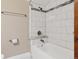 Bright bathroom featuring a tub with white subway tile and a decorative accent strip at 815 S Gaylord St, Denver, CO 80209