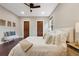 Spacious bedroom with hardwood floors, two closet doors, and modern decor at 815 S Gaylord St, Denver, CO 80209