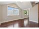 A well-lit bedroom featuring hardwood floors, and large windows that fill the room with natural light at 815 S Gaylord St, Denver, CO 80209
