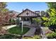 Charming home with a landscaped front yard, stone walkway, and a 'Coming Soon' sign at 815 S Gaylord St, Denver, CO 80209