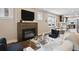 Comfortable living room with a fireplace, hardwood floors, and neutral decor at 815 S Gaylord St, Denver, CO 80209