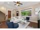 Inviting living room with a fireplace, hardwood floors, and a large window view at 815 S Gaylord St, Denver, CO 80209