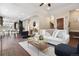 Spacious living room flowing into dining area, featuring hardwood floors at 815 S Gaylord St, Denver, CO 80209