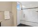 This renovated shower features updated white tile, a built-in bench, and frameless glass at 815 S Gaylord St, Denver, CO 80209