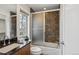 The bathroom features dark wood cabinets, granite countertops, and a tub/shower combo at 230 Hudson St, Denver, CO 80220