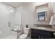 A modern basement bathroom showcasing a step-in shower, sleek fixtures, and contemporary design at 230 Hudson St, Denver, CO 80220