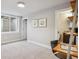 Basement bedroom with neutral carpeting and an adjacent full bathroom with a vessel sink and granite countertop at 230 Hudson St, Denver, CO 80220