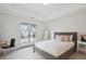 Bright bedroom featuring neutral colors, a balcony, and lots of natural light at 230 Hudson St, Denver, CO 80220
