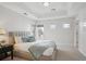 Bright bedroom featuring neutral colors, tray ceilings, and lots of natural light at 230 Hudson St, Denver, CO 80220