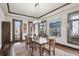 Elegant dining room with modern lighting and a large table for Gathering gatherings at 230 Hudson St, Denver, CO 80220