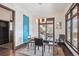 Dining room with stylish pendant lighting, a sleek table set, and a bright window offering a pleasant view at 230 Hudson St, Denver, CO 80220