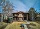Stunning stone-clad two-story home with a meticulously landscaped yard, exuding curb appeal at 230 Hudson St, Denver, CO 80220