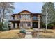 Charming two-story stone home with a balcony and well-maintained landscaping at 230 Hudson St, Denver, CO 80220
