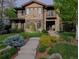 Stunning stone home with manicured lawn and landscaping offers timeless elegance and curb appeal at 230 Hudson St, Denver, CO 80220