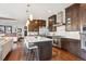 Beautiful kitchen with a large island, stainless steel appliances, and seamless flow to the living area at 230 Hudson St, Denver, CO 80220