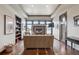 Relaxing living area features a fireplace, large windows, and built-in shelving for storage and decor at 230 Hudson St, Denver, CO 80220
