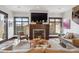Comfortable living room featuring a modern fireplace, recessed lighting and ample natural light from multiple windows at 230 Hudson St, Denver, CO 80220
