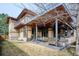 Spacious outdoor patio with a dining area, built-in grill, and comfortable seating, perfect for entertaining at 230 Hudson St, Denver, CO 80220