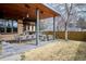 Inviting outdoor patio featuring a dining area, built-in grill, bar and comfortable seating for relaxing and entertaining at 230 Hudson St, Denver, CO 80220